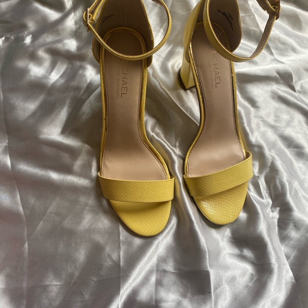 Gently worn yellow heeled sandals